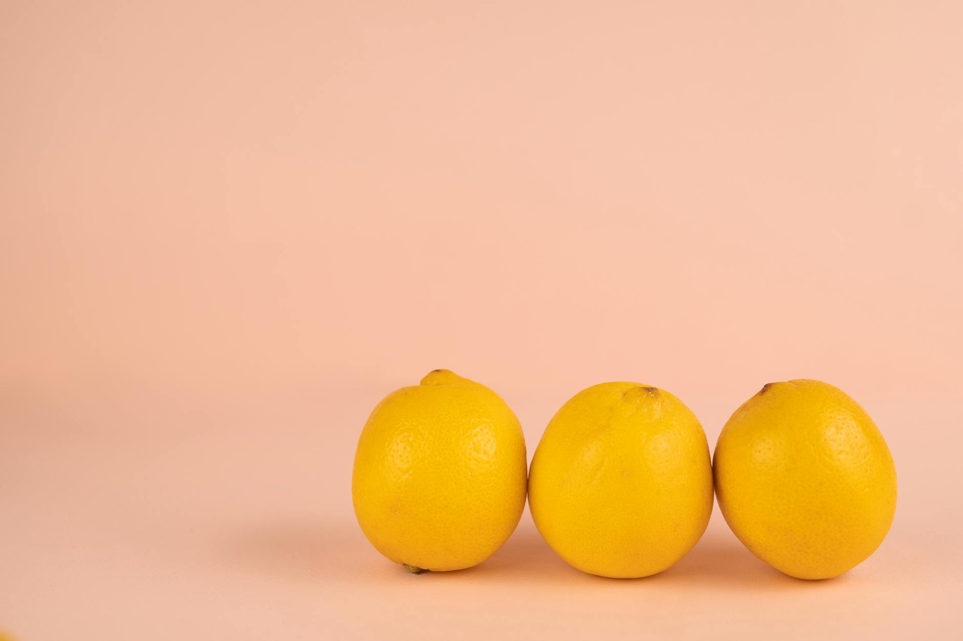 Vibrant arrangement of colorful sex toys on a bright yellow surface, showcasing modern clitoral vibrator design
